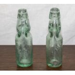 To vintage glass bottles with marble stoppers