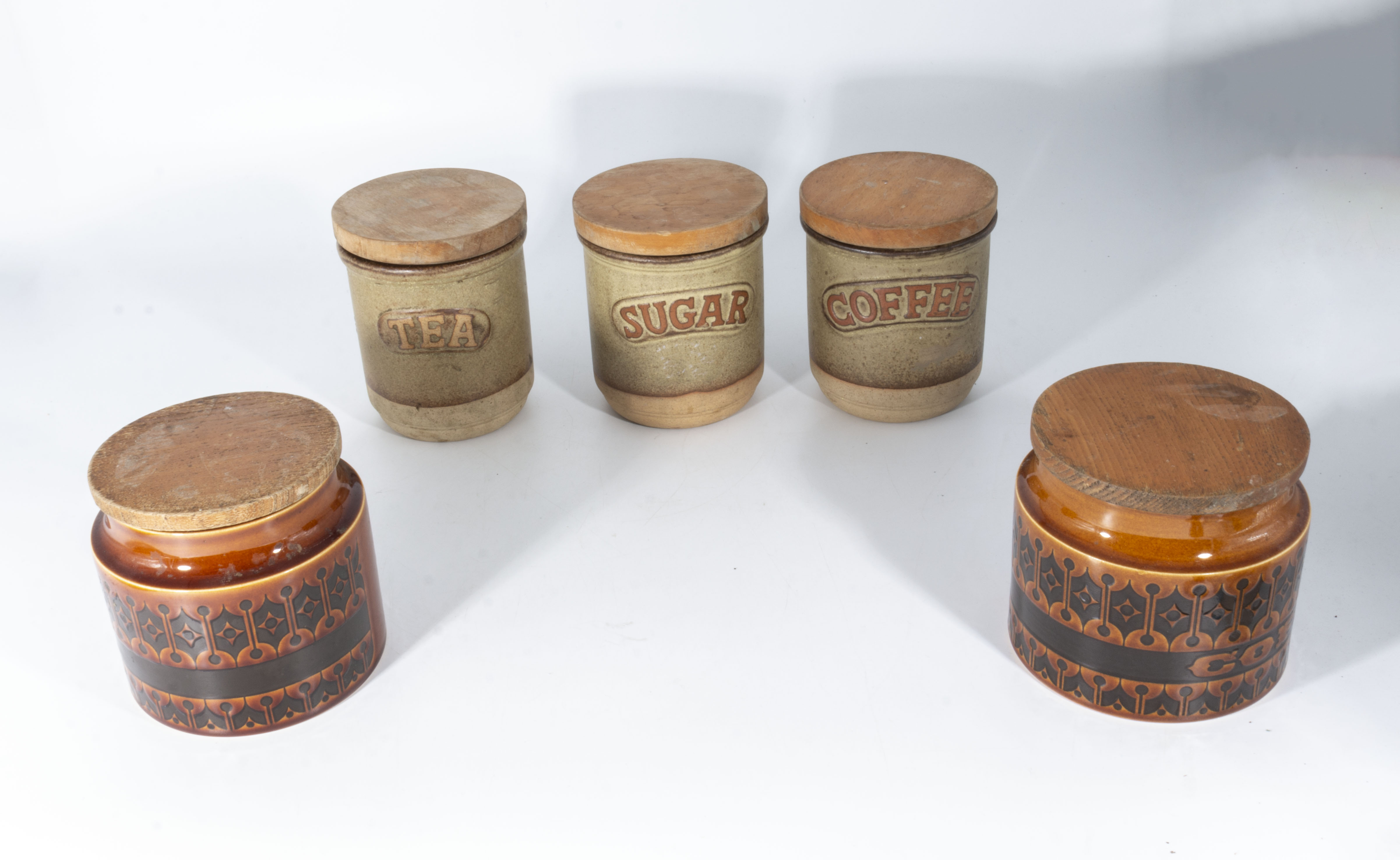 Three stoneware storage jars and two Hornsea jars