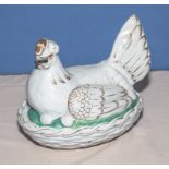 A pottery chicken egg basket