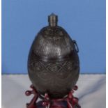 An early 18th century French/Dutch colonial carved coconut shell bug bear powder flask with rich