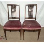 A pair of inlaid mahogany side chairs