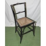 A lacquered and MOP bergere seated chair