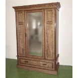 A Victorian satin walnut wardrobe with mirrored door and fitted interior, 210cm tall x 144cm wide (