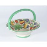 A Bursley ware Charlotte Rhead pottery basket decorated with fruit, 19cm wide