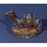 Jerusalem antique souvenir carved olivewood inkwell in the form of a recumbent camel resting, with a