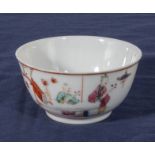 An antique Chinese tea bowl of fine quality decorated with a boy playing with his mother within