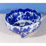 A flow blue pottery three footed bowl, 25cm diameter