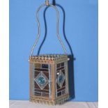 A Circa 1880 Victorian brass framed hallway lantern with four multi-coloured stained glass leaded