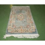 A Chinese style wool blue ground rug, 158cm x 93cm