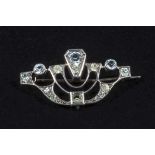 A small silvered metal Art Deco brooch, three stones missing, 3.5cm