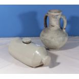 An antique earthenware vase and a water pig