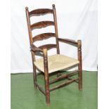A rush seated oak ladder back chair, purchased as part of the Abbotsford House estate, 115cm tall