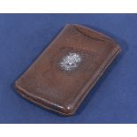 A vintage leather cigar case with initials S.H. in silver to front, 5" x 3.5"