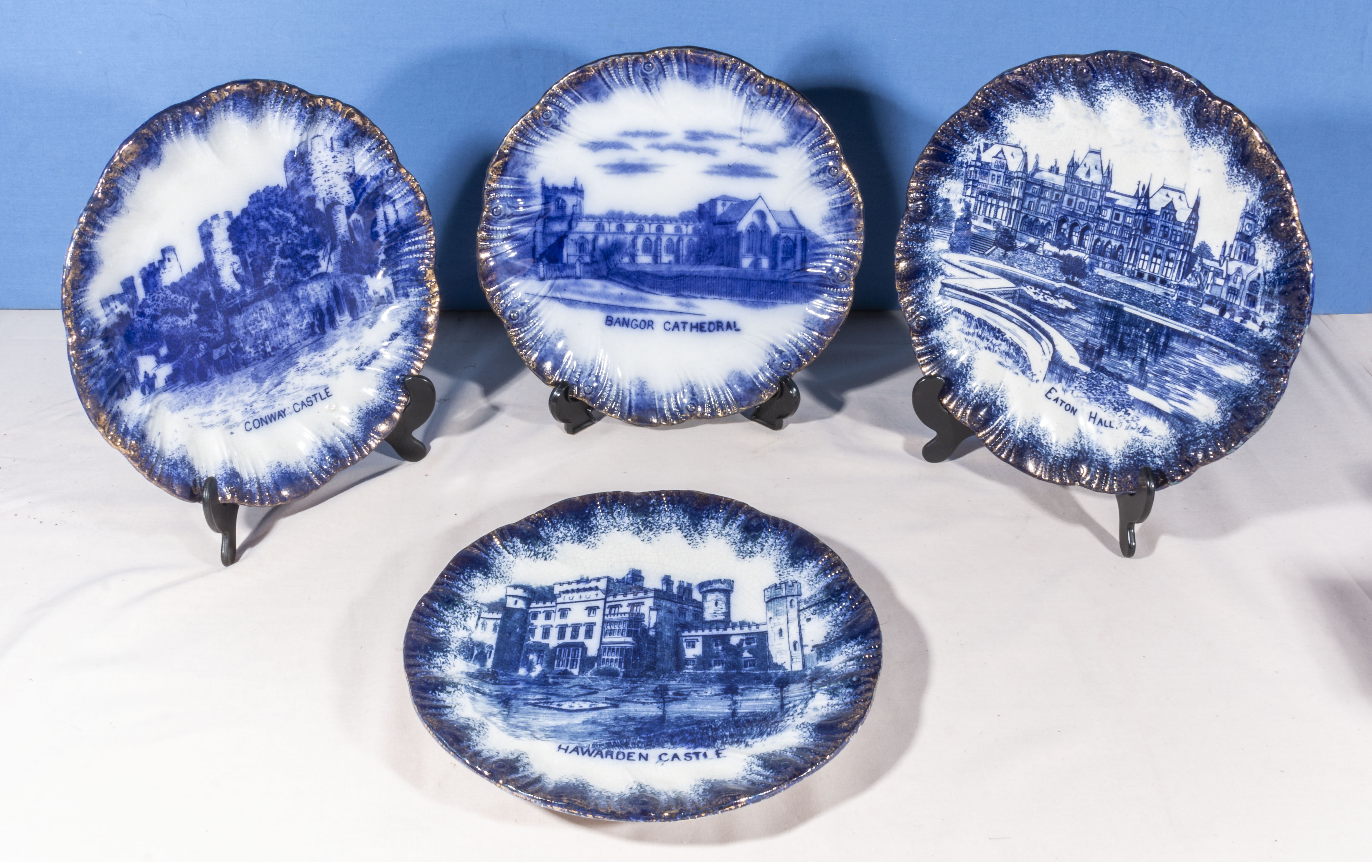 Four blue and white transfer printed plates, depicting Cathedrals and castles 24cm diameter