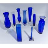 Nine blue glass vases