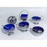Five blue glass preserve dishes and one other