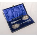 A pair of silver plated berry spoons