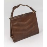 A 1930s silk lined leather handbag