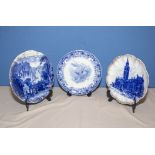 Three blue and white transferred printed plates, including Manchester Town Hall, centre plate