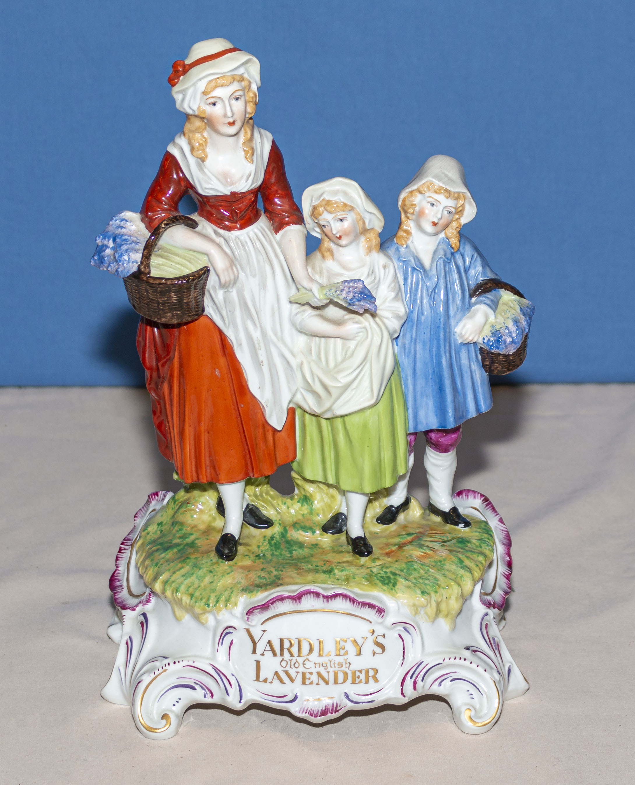 A Dresden porcelain Yardley soap advertising figure group, 30cm tall