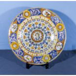 Antique majolica pottery charger of large size, finely decorated with roundels to the borders