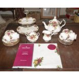 A Royal Albert Country Roses tea set together with cake stand and table cloth