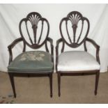 A pair of Edwardian Sheraton style mahogany arm chairs