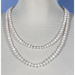 A long string of pearls, 128cm long