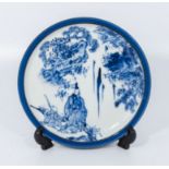 A Chinese blue and white dish decorated with a sage and a boy, 6.5" diameter