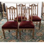 A set of four Edwardian oak dining chairs Arts and Crafts style.