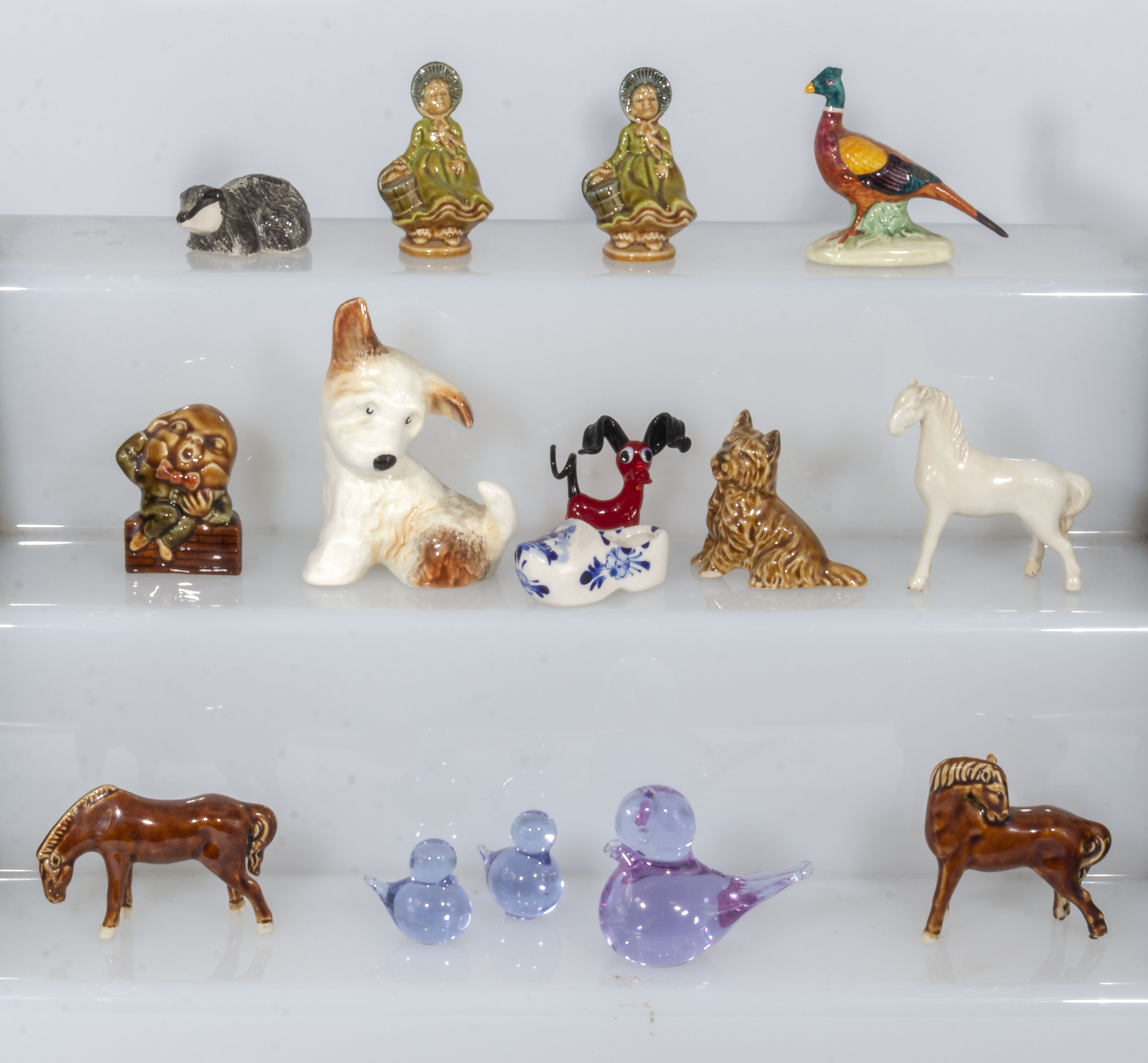 A collection of china and glass animals