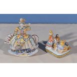 A pair of Russian decorated folk art pottery figures, one depicting a Cossack on horseback and the