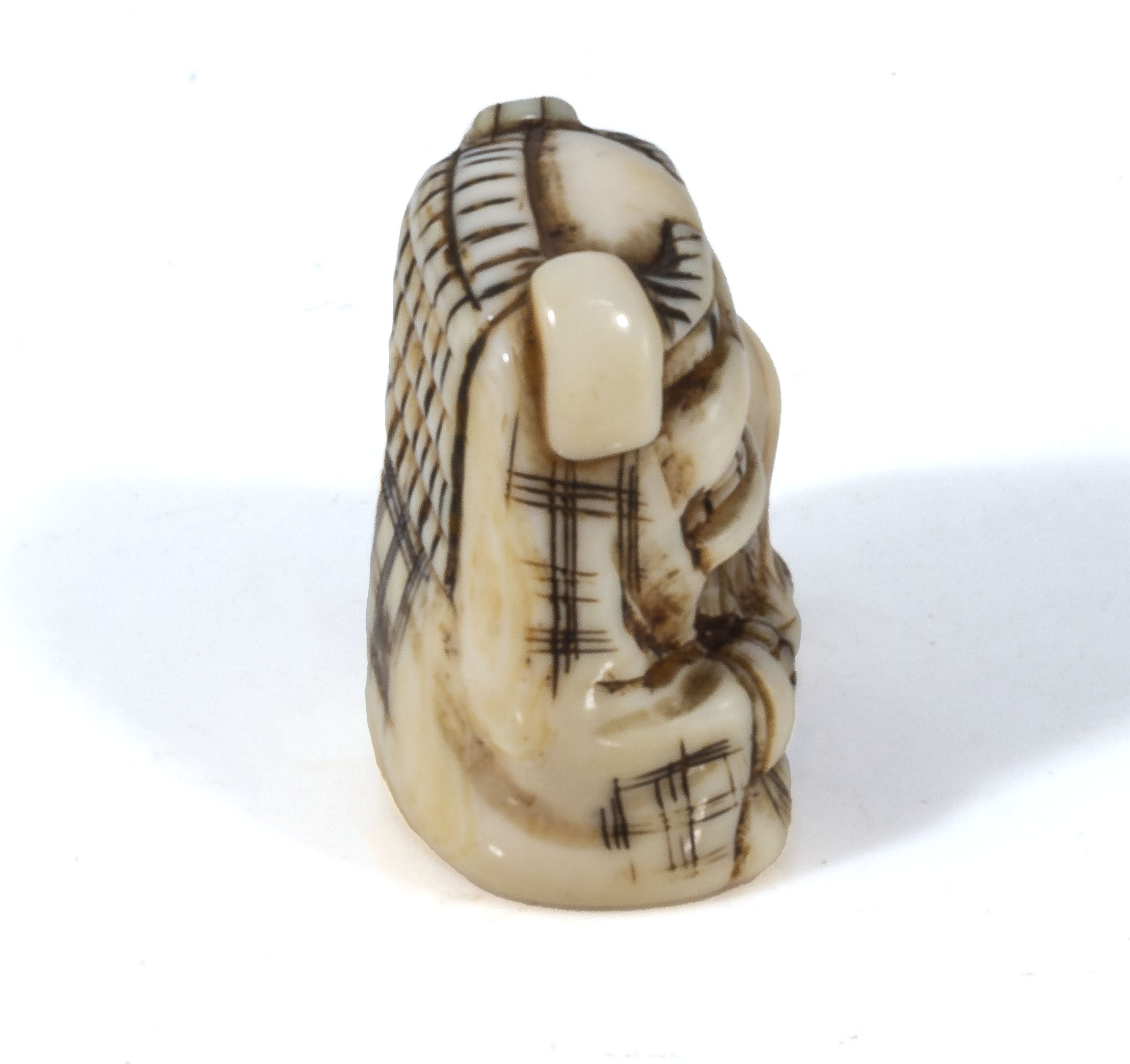 An antique Japanese ivory netsuke meiji period, depicting a boy dressed in a dragon outfit, with - Image 5 of 5