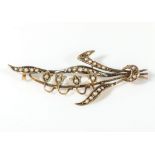 A 9ct gold brooch set with seed pearls, 2.7gms