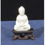 Small hardstone Buddha with hand-carved stand