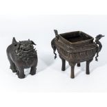 Two Chinese antique bronze censors, one in the shape of a kylin with an open mouth and long ears,