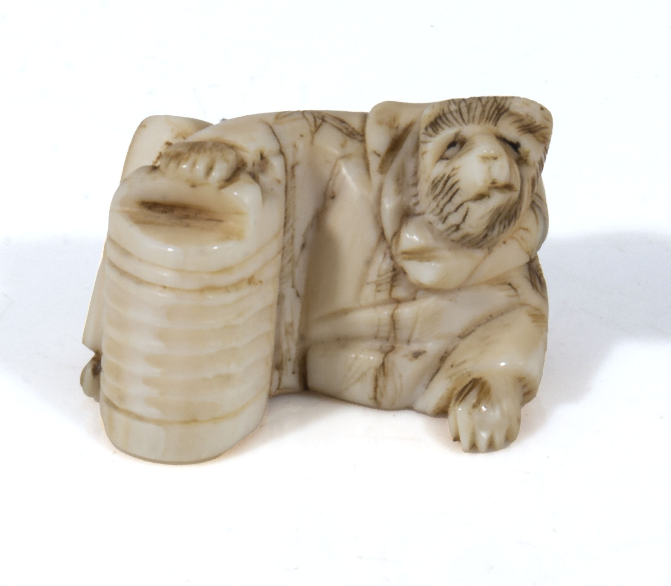 Japanese antique meiji period carved ivory netsuke in the form of a fox dressed in a robe,