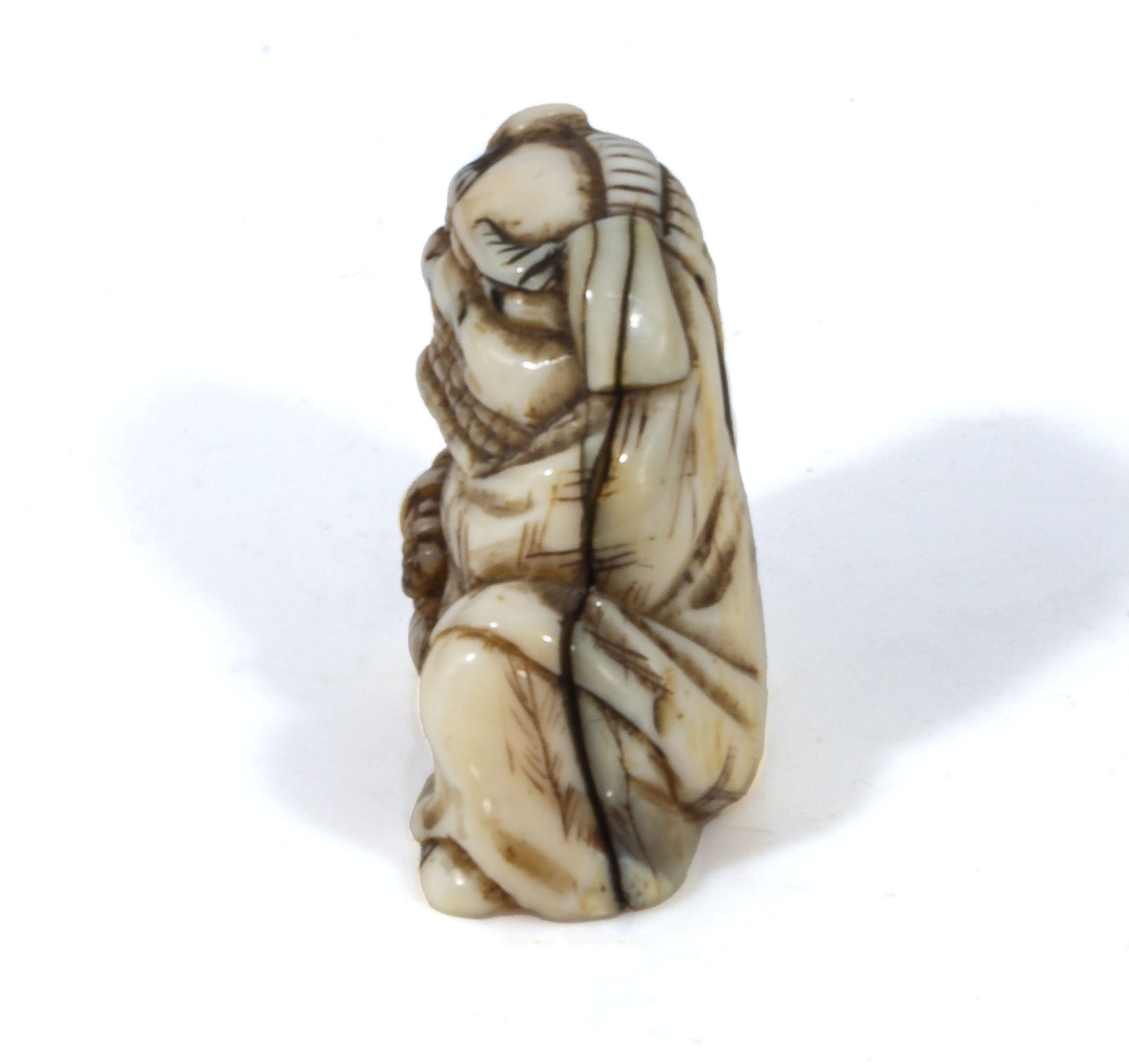 An antique Japanese ivory netsuke meiji period, depicting a boy dressed in a dragon outfit, with - Image 2 of 5