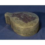 An antique Japanese meiji period brass hinged box in the shape of a peach, finely engraved to the