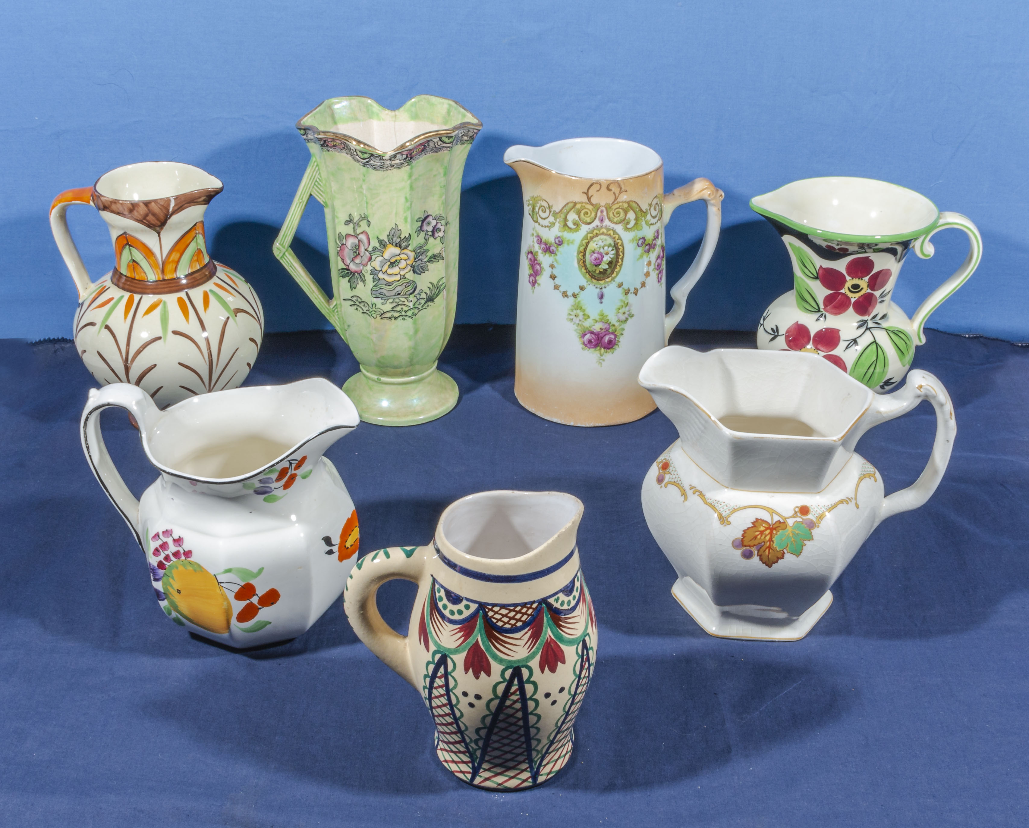 Seven vintage pottery jugs