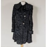 A lady's black astrakan coat