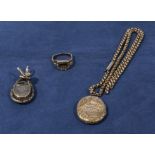 A 9ct gold locket together with a pinchbeck mourning brooch, ring and a chain