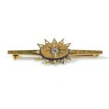 A 9ct gold bar brooch set with a diamond and seed pearls