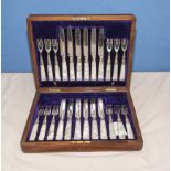 A twelve piece setting canteen of cutlery with mother of pearl handles