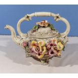 A large Capodimonte teapot, 32cm wide and 23cm tall