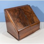 A Victorian walnut slope front writing desk, fitted interior, 41cm wide x 29cm deep x 34cm tall