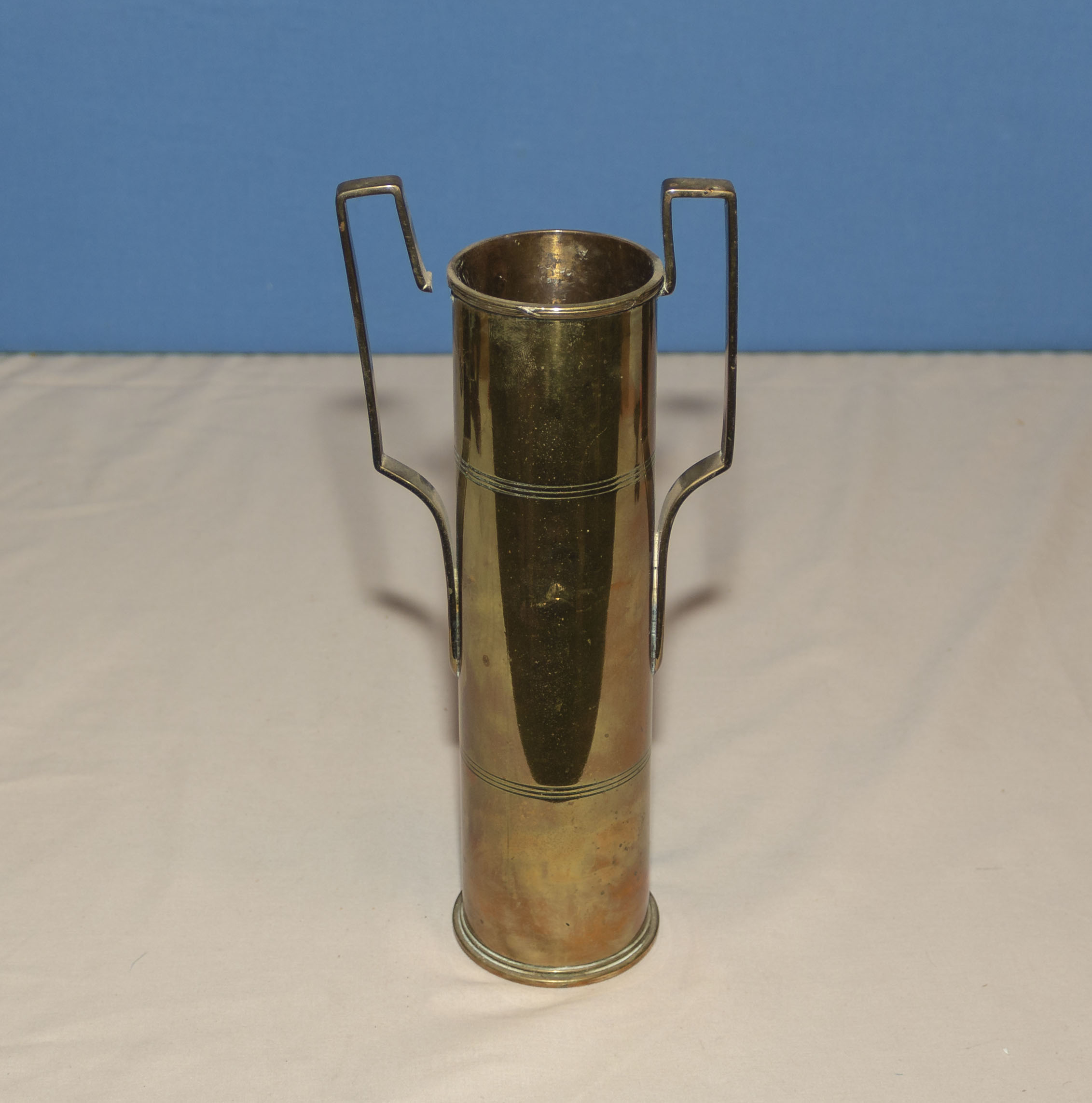 A trench art shell vase, shell measures 25cm