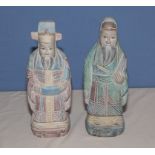 A pair of carved wood figures, 34cm tall