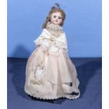 A porcelain doll stamped SFBJ Co. Paris 10/ she is 32cm tall