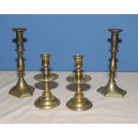 Two pairs of brass candlesticks